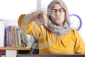 Muslim Woman Thumbs Down, Dissapointed Expression