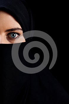 Muslim woman wearing black veil