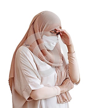 Muslim woman wearing a surgical mask feeling sick on white background