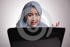 Muslim Woman Working on Laptop Shocked Stunned gesture