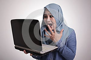 Muslim Woman Working on Laptop Shocked Stunned gesture