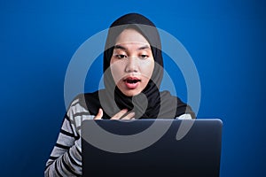 Muslim Woman Working on Laptop Shocked Stunned gesture