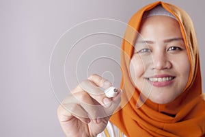 Muslim Woman Writing on Virtual Screen