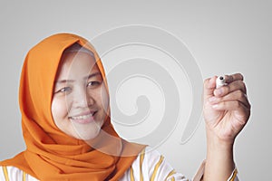 Muslim Woman Writing on Virtual Screen