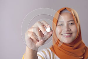 Muslim Woman Writing on Virtual Screen