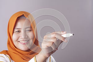 Muslim Woman Writing on Virtual Screen