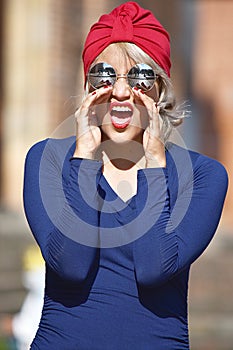 A Muslim Woman Yelling Wearing Turban