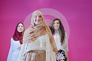 Muslim women in fashionable dress isolated on pink