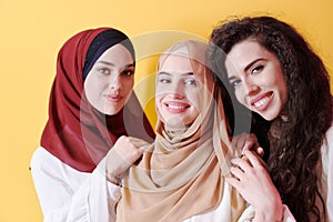 Muslim women in fashionable dress isolated on yellow
