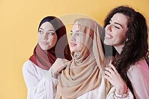 Muslim women in fashionable dress isolated on yellow