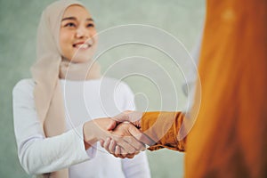 Muslim women's business handshake