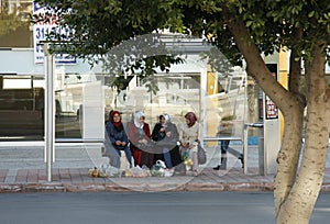 Muslim women waiting for a bus