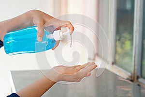 Muslim women wash hand with soap alcohol gel for sanitizer in kitchen sink concept for prevent Hygiene health care. Quarantine