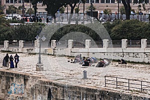 Muslims praying near the golden tower in Seville, Spain.