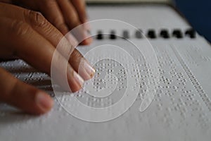 Muslims reading braille koran Quran