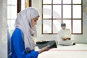 Muslims reading from the quran photo