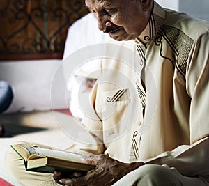 Muslims reading from the Quran