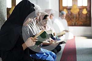 Muslims reading from the Quran