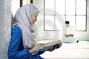 Muslims reading from the Quran