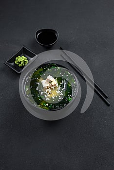 Muso soup. Asian food on a dark background. Vertical smartphone image format for storis photo