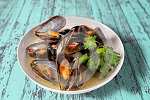 Mussels cooked with an Italian recipe called tarantina photo