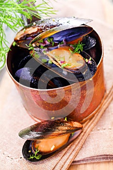 Mussels in a copper saucepan