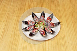 Mussels a la chalaca is a dish of Peruvian cuisine made with cooked photo