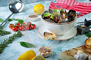 Mussels in Plate served with tomatos, toast and lemon and garlic