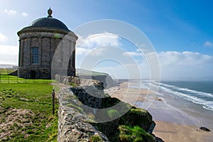 Mussenden Temple and Benone Beach in Castlerock, coast of Atlantic Ocean in Northern Ireland photo