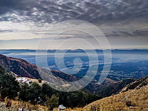 Mussoorie, Uttarakhand, India. A scenic view of vastly spread Dehradun city valley from a hilltop in Mussoorie