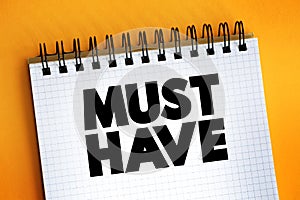 Must Have text quote on notepad, concept background