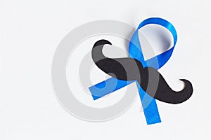 Mustache pattern with blue ribbon symbol. Movember concept.