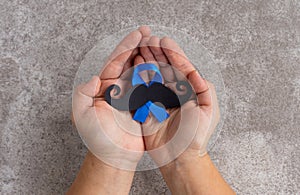 Mustache pattern with blue ribbon symbol. November movember concept.