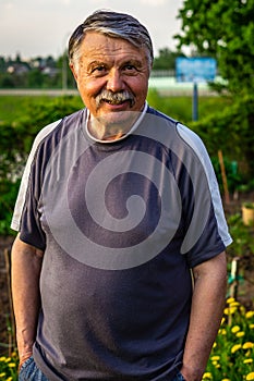 Mustachioed old man resting in the Park