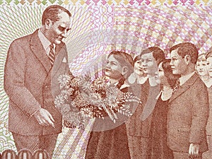 Mustafa Kemal Ataturk with a children a portrait from Turkish money photo