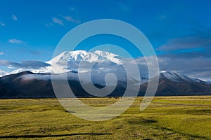 Mustagh Ata Mountain at Karakul Lake in Pamir Mountains, Akto County, Kizilsu Kirghiz Autonomous Prefecture, Xinjiang, China.