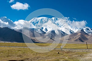 Mustagh Ata Mountain at Karakul Lake in Pamir Mountains, Akto County, Kizilsu Kirghiz Autonomous Prefecture, Xinjiang, China.