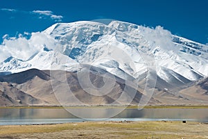 Mustagh Ata Mountain at Karakul Lake in Pamir Mountains, Akto County, Kizilsu Kirghiz Autonomous Prefecture, Xinjiang, China.