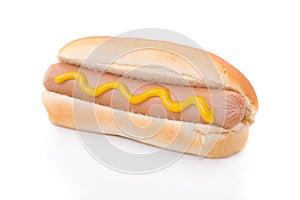 Mustard hotdog isolated on white photo