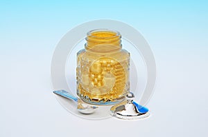 Mustard pot with spoon.