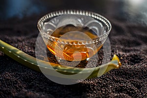 Mustard seed face mask for glowing skin. Shot of face mask ingredients which are mustard seeds, aloe vera, and some honey in a gla photo