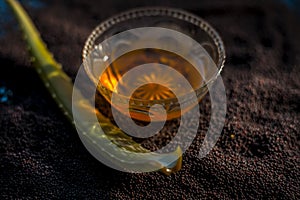 Mustard seed face mask for glowing skin. Shot of face mask ingredients which are mustard seeds, aloe vera, and some honey in a gla photo