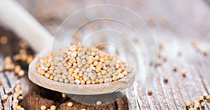 Mustard Seeds on a cooking Spoon