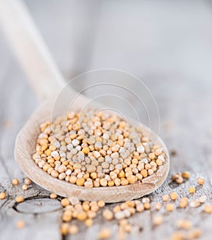 Mustard Seeds on a cooking Spoon