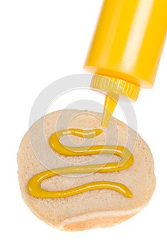 Mustard spread on hamburger bun