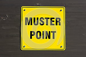 Muster point sign on a wall