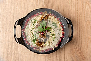 Mutabbal or mutabal granished with pomegranate seeds served in dish isolated on table top view of arabian food