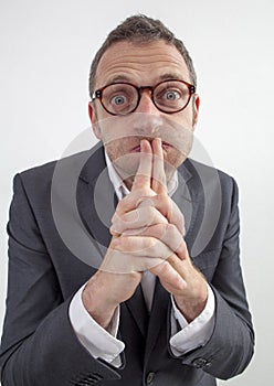 Mute manager puffing his cheeks for corporate silence or taboo