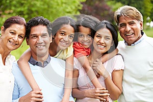 Muti-Generation Indian Family Walking In Countryside