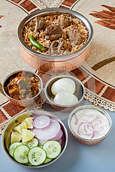 Mutton biryani with traditional sides